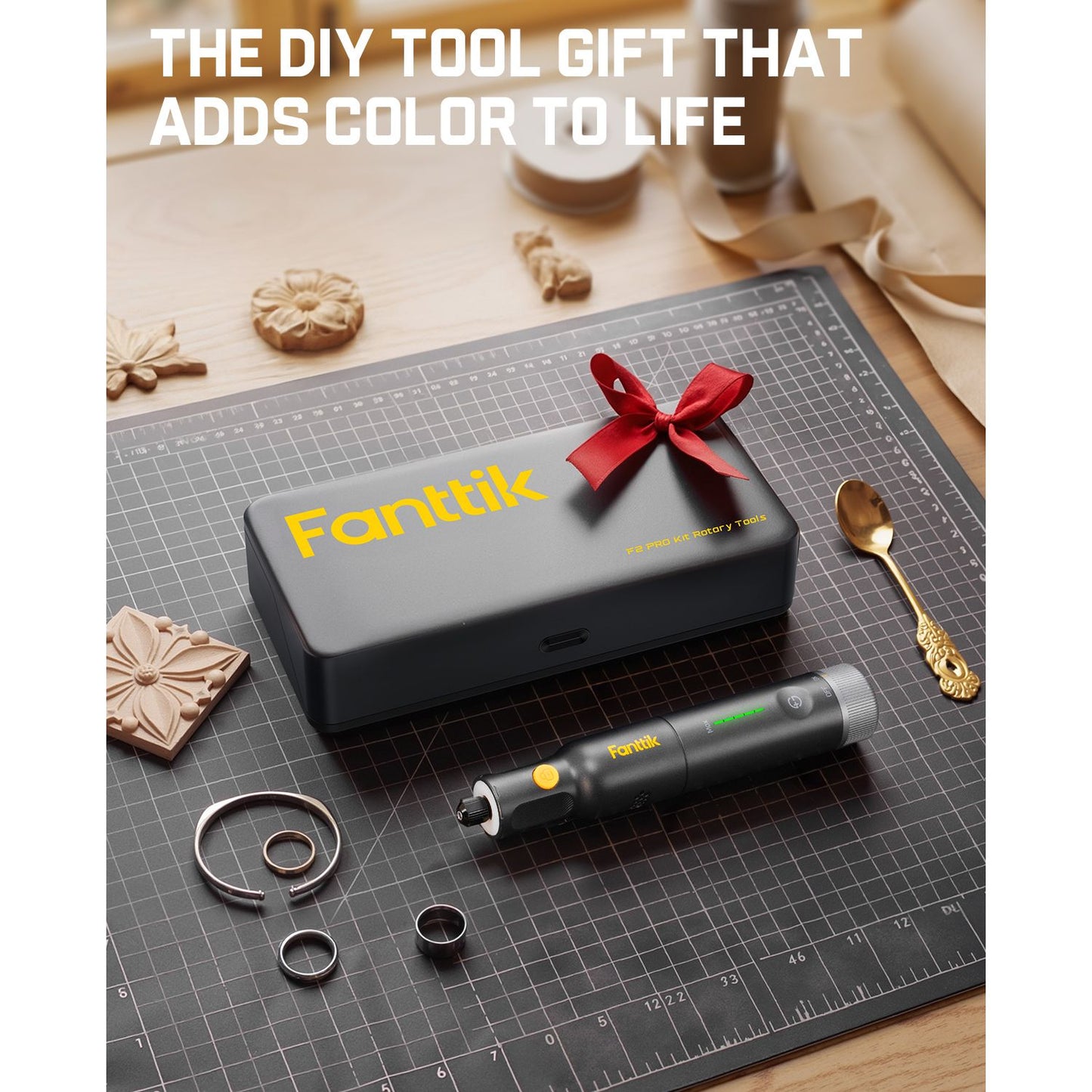 Fantik tool set with a red bow on a cutting mat, surrounded by decorative items.