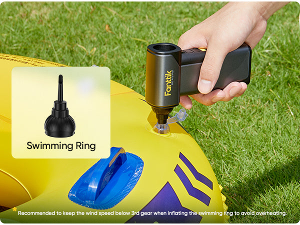 Person inflating a swimming ring with a Fanttik B10 Pro Max Electric Air Duster, grass background
