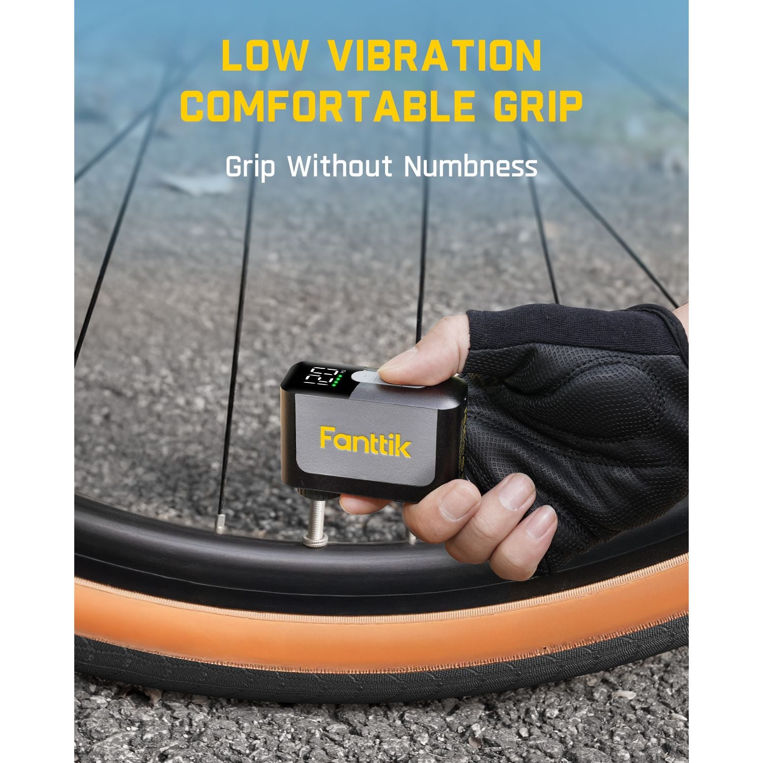 Hand holding a Fanttik X10 Ace Mini Bike Pump near a bicycle tire  emphasizing low vibration and comfortable grip.