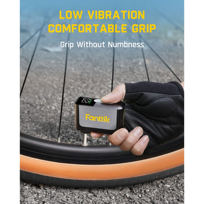 Hand holding a Fanttik X10 Ace Mini Bike Pump near a bicycle tire  emphasizing low vibration and comfortable grip.