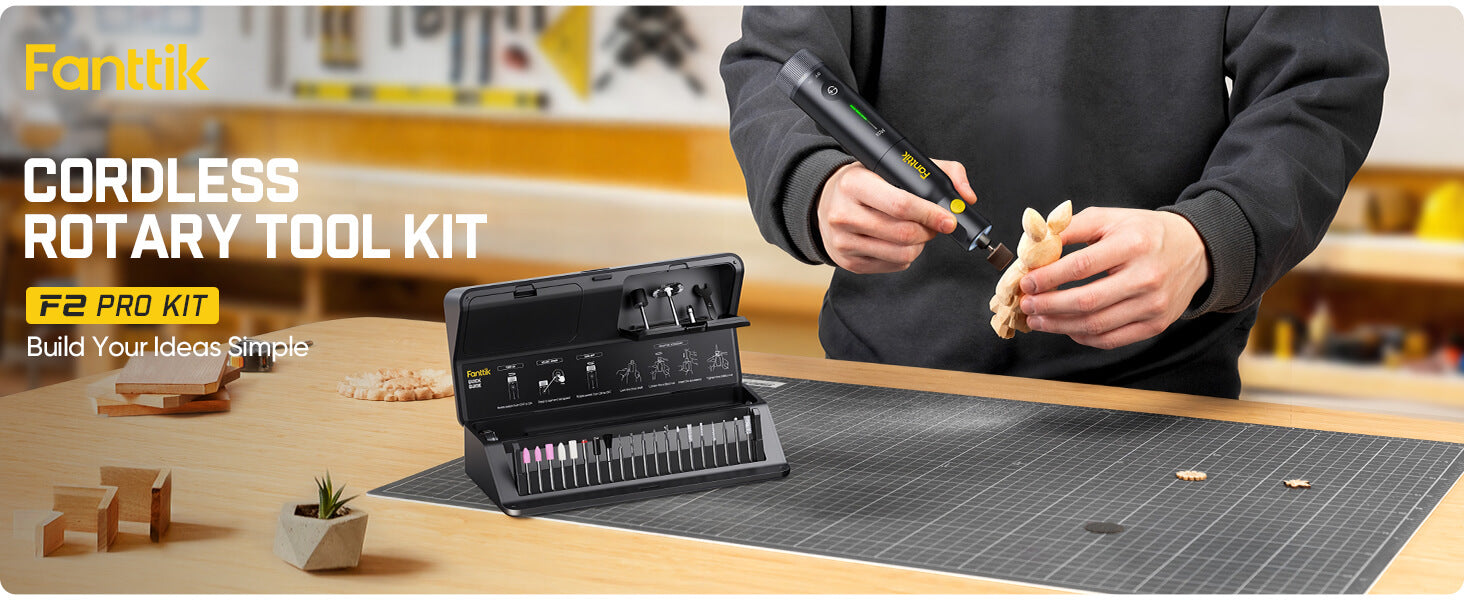 Person using a Fanttik F2 Pro Kit Cordless Rotary Toolon a workbench.
