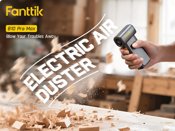 Electric air duster being used to clear wood shavings from a workbench, with 'Fanttik' branding.