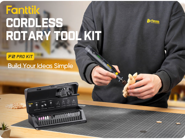 Person using a Fanttik F2 Pro Kit Cordless Rotary Toolon a workbench.